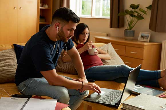 Lady and boy using laptop