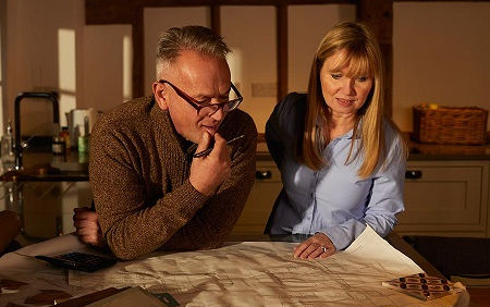 Man and woman looking at paperwork
