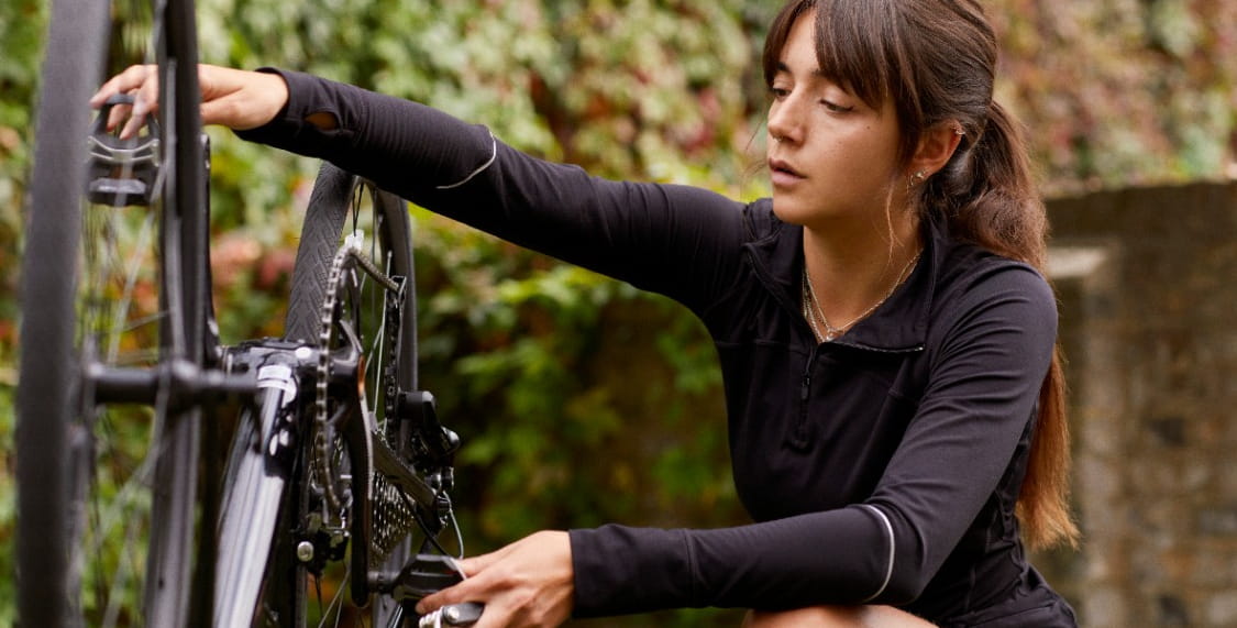 Girl fixing bike