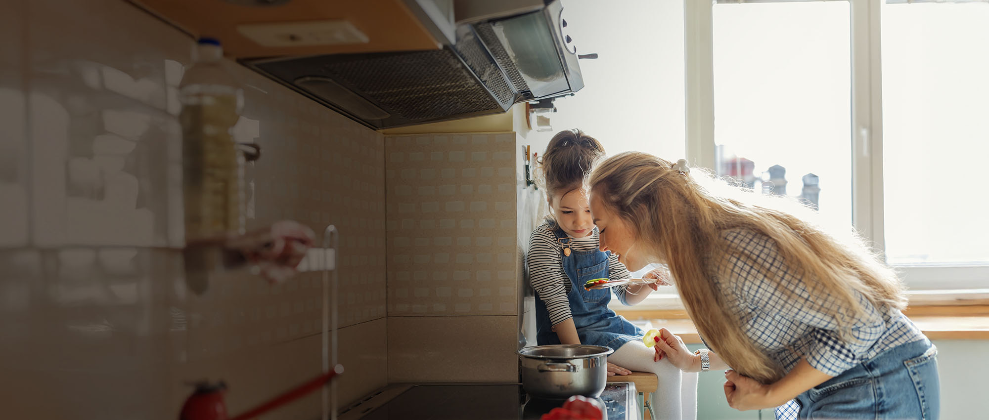 Mother and child cooking together