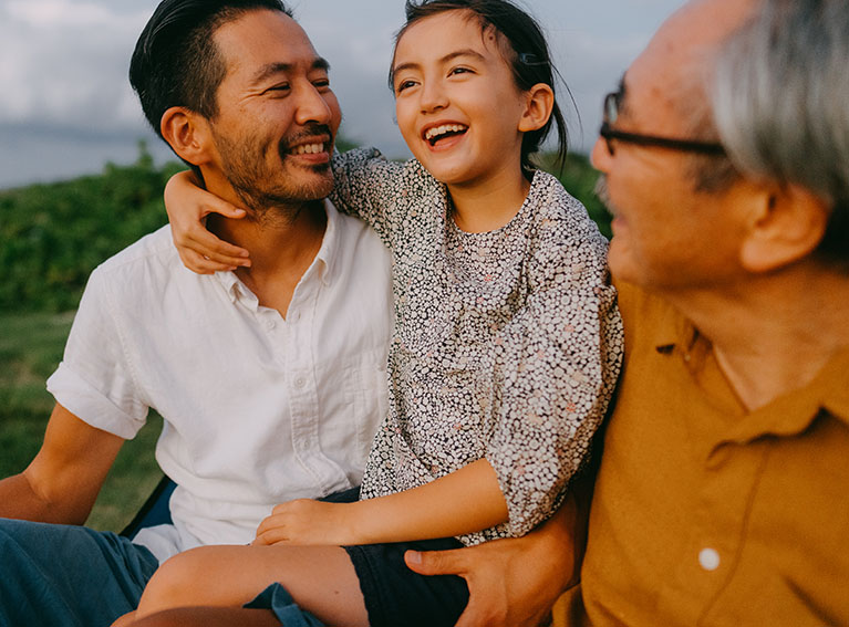 Two men and child laughing
