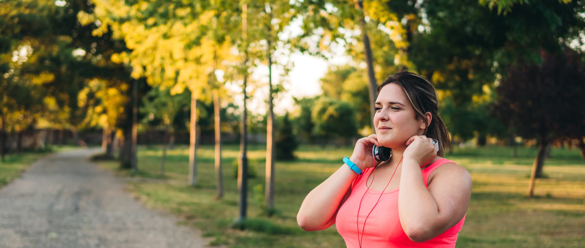 Lady outdoors with headphones