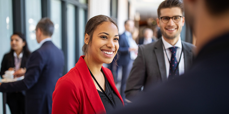 Woman in red blazer smiling
